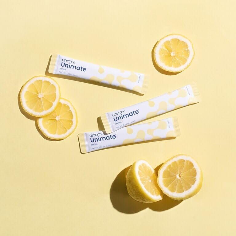 UNICITY Unimate Lemon Tütchen dekoriert mit Zitronenscheiben